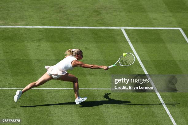 Camila Giorgi of Italy returns against Denmark's Caroline Wozniacki during her first round match on day four of the Nature Valley International at...