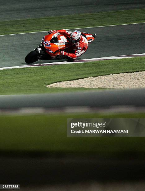 Australia's Casey Stoner of Ducati Marlboro Team races during the 2010 MotoGP free qualification practice at the Losail International Circuit in Doha...