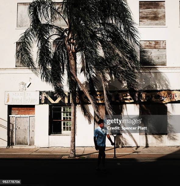 Man walks through the downtown section of town, which has come to rely on the border-crossing traffic on June 25, 2018 in Brownsville, Texas....