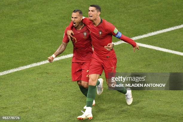 Portugal's forward Ricardo Quaresma celebrates scoring the opening goal with Portugal's forward Cristiano Ronaldo during the Russia 2018 World Cup...