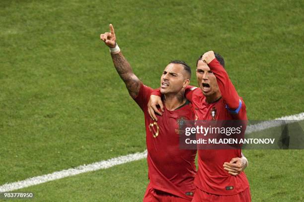 Portugal's forward Ricardo Quaresma celebrates scoring the opening goal with Portugal's forward Cristiano Ronaldo during the Russia 2018 World Cup...