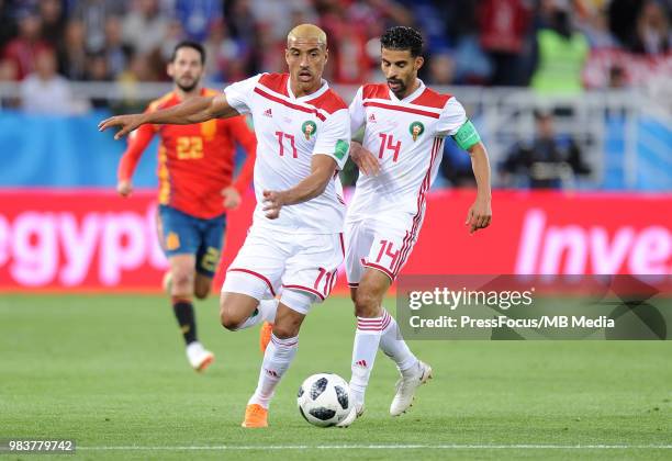 Nabil Dirar of Morocco and Mbark Boussoufa of Morocco in action during the 2018 FIFA World Cup Russia group B match between Spain and Morocco at...