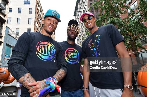 Michael Beasley of the New York Knicks, Reggie Bullock of the Detroit Pistons and John Henson of the Milwaukee Bucks pose for a photo during the NYC...