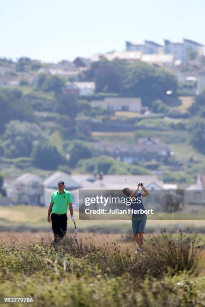 Michael Wilson of Royal North Devon Golf Club looks on as his prtner Mark Lee plays a shot during The Lombard Trophy South West Qualifier at Royal...