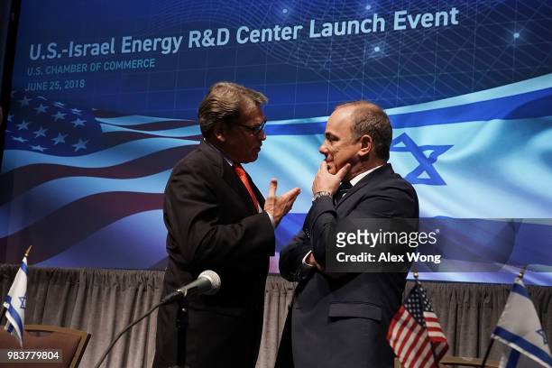 Secretary of Energy Rick Perry talks to Israeli Minister of National Infrastructure, Energy and Water Resources Yuval Steinitz after a lunch event at...