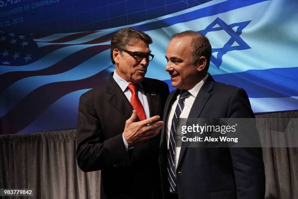 Secretary of Energy Rick Perry talks to Israeli Minister of National Infrastructure, Energy and Water Resources Yuval Steinitz after a lunch event at...