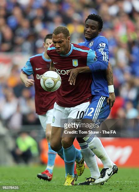 John Carew of Aston Villa tries to hold back Jon Obi Mikel of Chelsea during the FA Cup sponsored by E.ON Semi Final match between Aston Villa and...