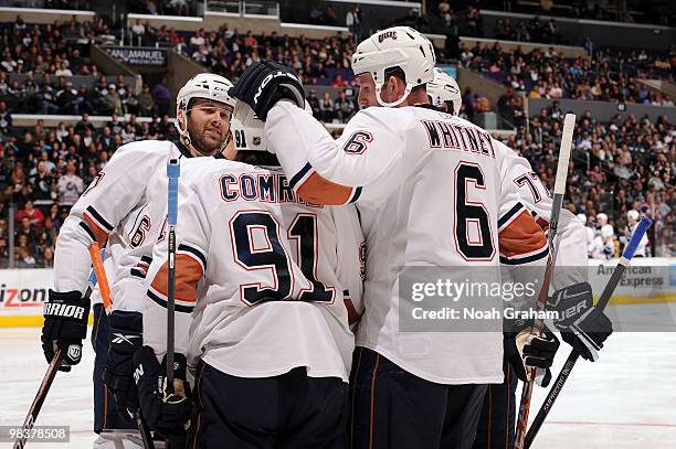 Mike Comrie of the Edmonton Oilers celebrates with teammate Ryan Whitney after scoring a goal against the Los Angeles Kings on April 10, 2010 at...