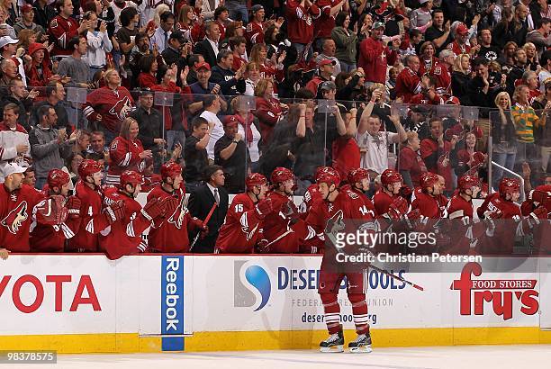 Taylor Pyatt of the Phoenix Coyotes celebrates with teammates on the bench after scoring against the Nashville Predators during the NHL game at...