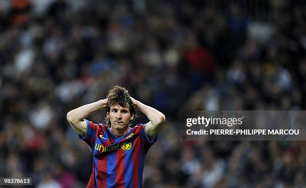 Barcelona's Argentinian forward Lionel Messi gestures during the 'El Clasico' Spanish League football match Real Madrid against Barcelona at the...