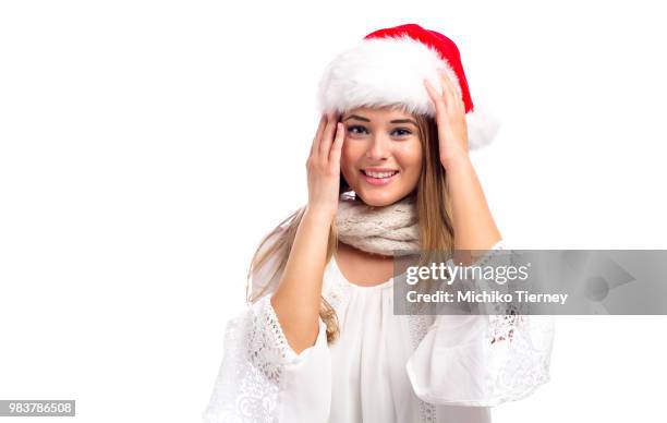 happy young woman with santa hat - conch shell on white stock pictures, royalty-free photos & images