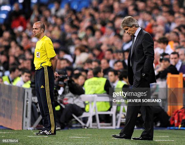 Real Madrid Chilian coach Manuel Pellegrini reacts during the 'El Clasico' Spanish League football match Real Madrid against Barcelona at the...