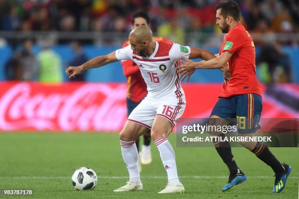 Spain's defender Jordi Alba vies with Morocco's forward Noureddine Amrabat during the Russia 2018 World Cup Group B football match between Spain and...