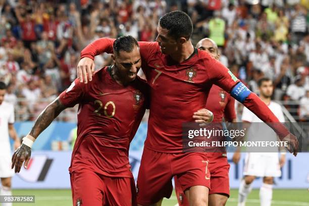 Portugal's forward Ricardo Quaresma celebrates scoring the opening goal with Portugal's forward Cristiano Ronaldo during the Russia 2018 World Cup...