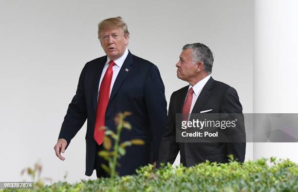 President Donald Trump and King Abdullah II walk the colonnade of the White House on June 25, 2018 in Washington, DC.