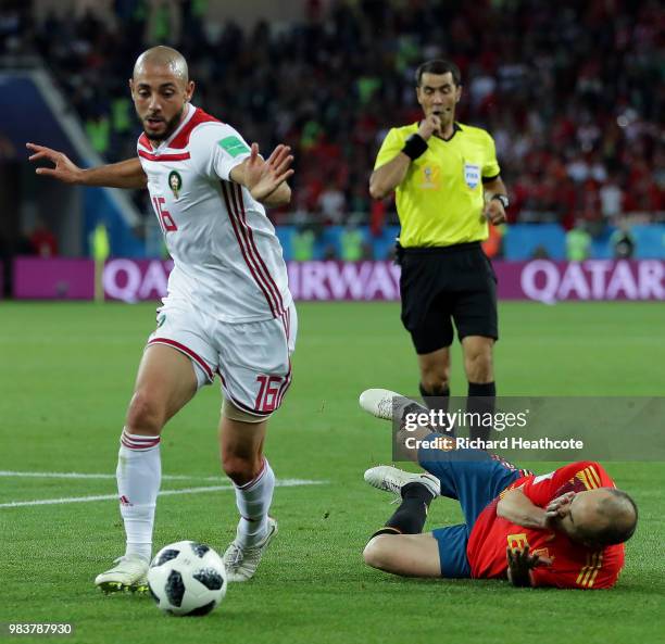 Andres Iniesta of Spain goes to ground after a challenge from Noureddine Amrabat of Morocco during the 2018 FIFA World Cup Russia group B match...