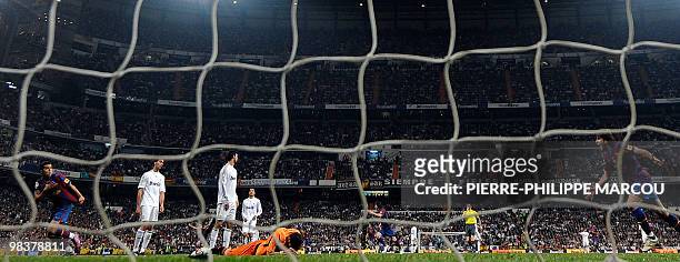 Barcelona's forward Pedro Rodriguez celebrates after scoring during the 'El Clasico' Spanish League football match Real Madrid against Barcelona at...