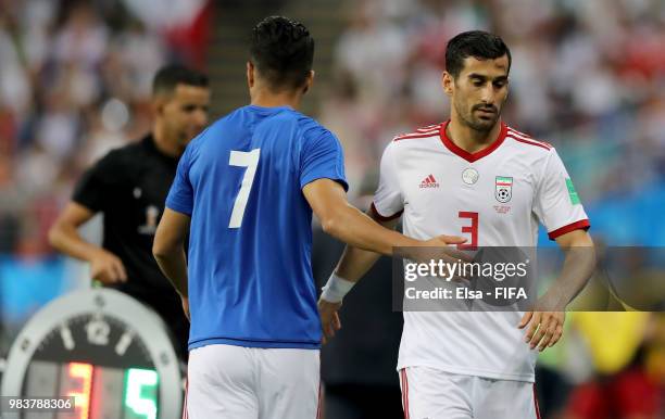 Masoud Shojaei acknowledges Ehsan Haji Safi of Iran as he is substituted during the 2018 FIFA World Cup Russia group B match between Iran and...