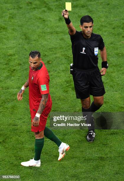 Ricardo Quaresma of Portugal is shown a yellow card by referee Enrique Caceres during the 2018 FIFA World Cup Russia group B match between Iran and...
