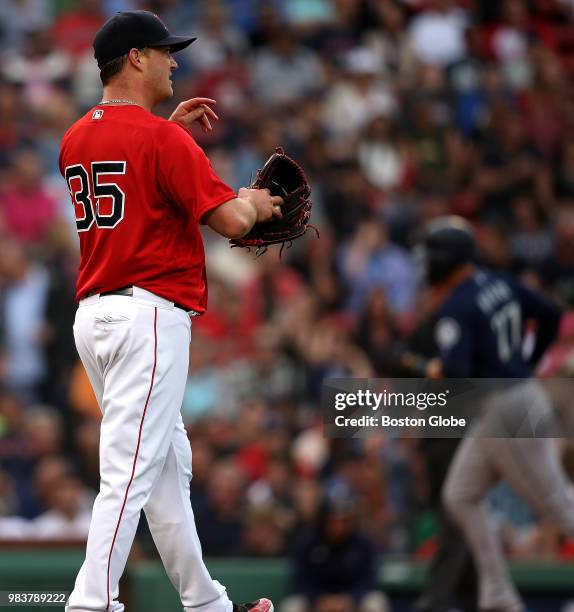 Boston Red Sox starting pitcher Steven Wright is pictured after giving up his fourth run during the first inning to Seattle Mariners first baseman...