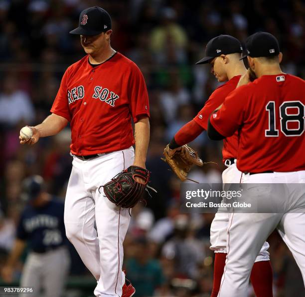 Boston Red Sox starting pitcher Steven Wright prepares to hand over the ball during the fourth inning. The Boston Red Sox host the Seattle Mariners...