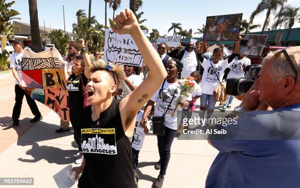 Tekoah Flory, center, at front of a march that includes family of Wakiesha Wilson, a black woman who was found dead in a LAPD jail in 2016, during a...