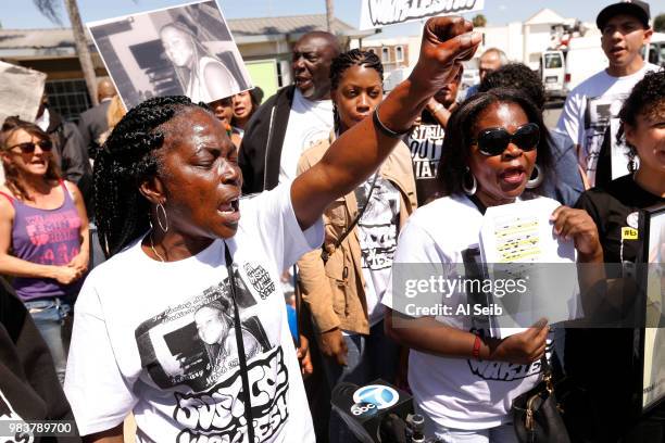 Lisa Hines, left, Mother of Wakiesha Wilson, a black woman who was found dead in a LAPD jail in 2016, demands LAPD Chief Charlie Beck is fired as she...