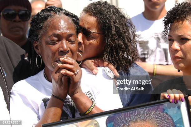 Lisa Hines, left, Mother of Wakiesha Wilson, a black woman who was found dead in a LAPD jail in 2016, is comforted by friend Gidget Noel, right,...