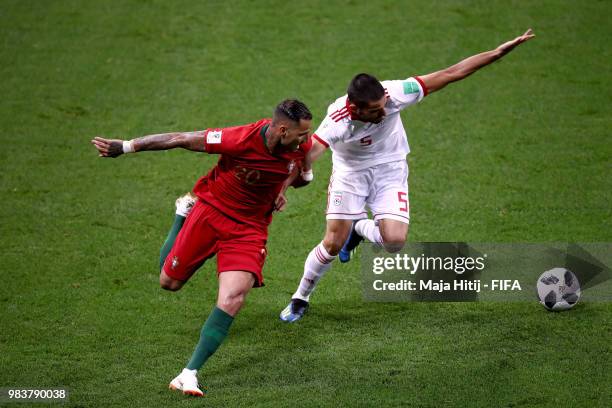 Ricardo Quaresma of Portugal battles for possession with Milad Mohammadi of Iran during the 2018 FIFA World Cup Russia group B match between Iran and...