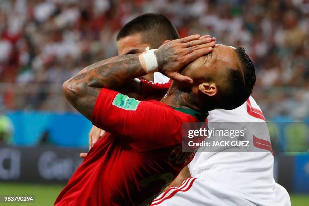 Portugal's forward Ricardo Quaresma reacts following a challenge during the Russia 2018 World Cup Group B football match between Iran and Portugal at...