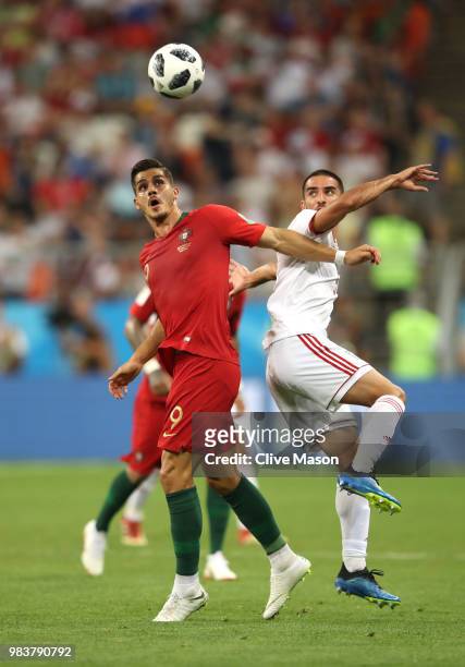 Andre Silva of Portugal battles for possession with Vahid Amiri of Iran during the 2018 FIFA World Cup Russia group B match between Iran and Portugal...