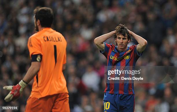 Lionel Messi of Barcelona reacts beside Iker Casillas of Real Madrid during the La Liga match between Real Madrid and Barcelona at the Estadio...