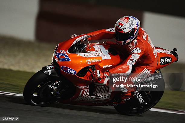 Casey Stoner of Australia and Ducati Marlboro Team rounds a bend during the second day of testing ahead of the Qatar Grand Prix at Losail Circuit on...