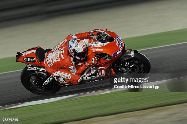 Casey Stoner of Australia and Ducati Marlboro Team rounds a bend during the second day of testing ahead of the Qatar Grand Prix at Losail Circuit on...