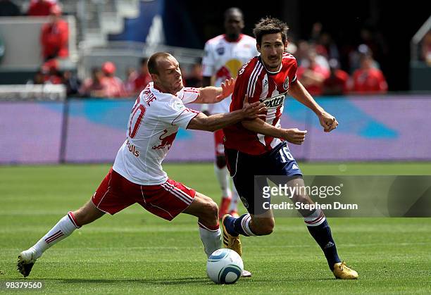Joel Lindpere of the New York Red Bulls battles for the ball with Sacha Kljestan of Chivas USA on April 10, 2010 at the Home Depot Center in Carson,...