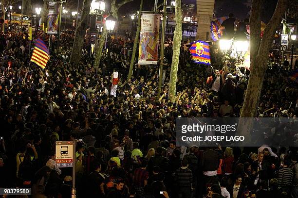 Barcelona's supporters celebrate their team's victory against Real Madrid in "The Ramblas" street in Barcelona on April 10, 2010 after the 'El...