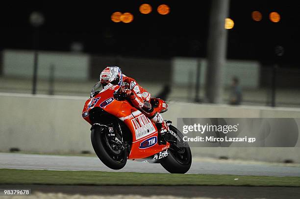 Casey Stoner of Australia and Ducati Marlboro Team lifts his front wheel during the second day of testing ahead of the Qatar Grand Prix at Losail...