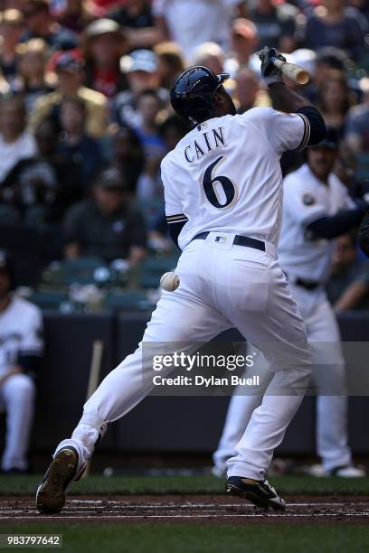 Lorenzo Cain of the Milwaukee Brewers is hit by a pitch in the first inning against the St. Louis Cardinals at Miller Park on June 23, 2018 in...