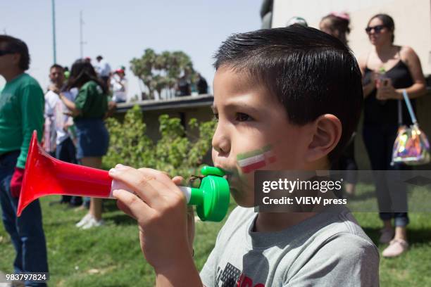 Child blows a bugle and People celebrate after winning their FIFA World Cup - Group F - South Korea vs Mexico match on June, 23 2018 in Mexicali,...