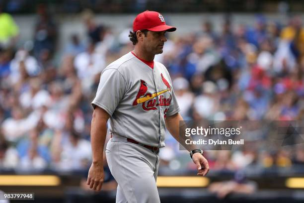 Manager Mike Matheny of the St. Louis Cardinals walks across the field in the seventh inning against the Milwaukee Brewers at Miller Park on June 23,...