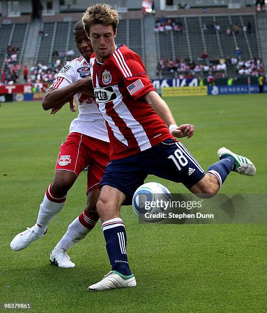 Blair Gavin of Chivas USA centers the ball in front of Jeremy Hall of the New York Red Bulls on April 10, 2010 at the Home Depot Center in Carson,...