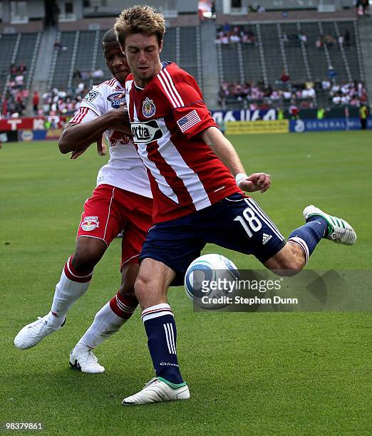 Blair Gavin of Chivas USA centers the ball in front of Jeremy Hall of the New York Red Bulls on April 10, 2010 at the Home Depot Center in Carson,...