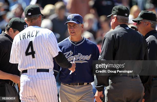 Manager Jim Tracy of the Colorado Rockies exchanges line ups with manager Bud Black of the San Diego Padres during MLB action on Opening Day at Coors...