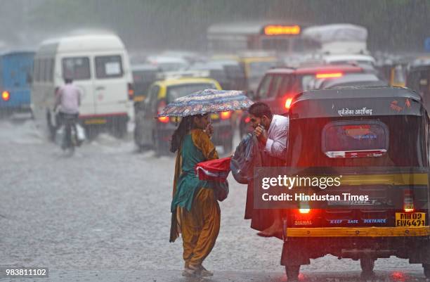 Vehicles wades through water logged street due to heavy rain at Saha Road, Andheri on June 25, 2018 in Mumbai, India. Heavy downpour led to...