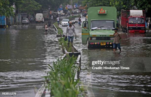 Waterlogged due to heavy rain at S.V Road,Bandra on June 25, 2018 in Mumbai, India. Heavy downpour led to waterlogging at several places including...