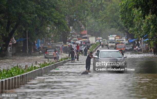 Waterlogged due to heavy rain at S.V Road,Bandra on June 25, 2018 in Mumbai, India. Heavy downpour led to waterlogging at several places including...