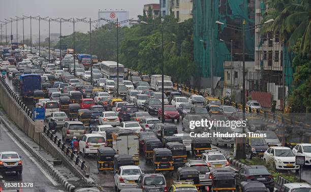 Heavy traffic due to rain on WEH at Santacruz on June 25, 2018 in Mumbai, India. Heavy downpour led to waterlogging at several places including roads...