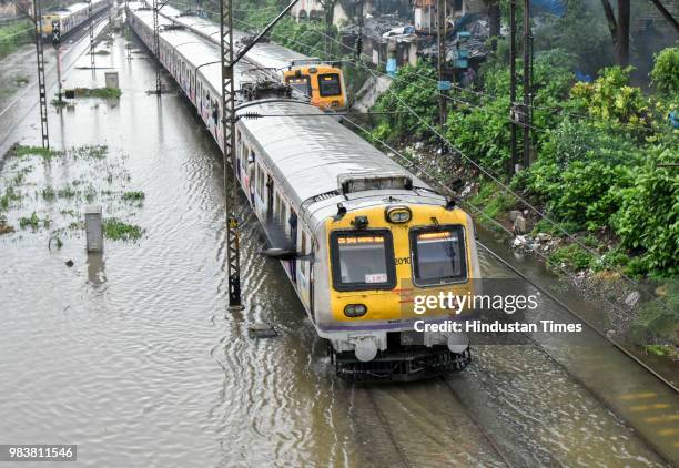 Water logging on railway track between Sion and Matunga after heavy rains on June 25, 2018 in Mumbai, India. Heavy downpour led to waterlogging at...