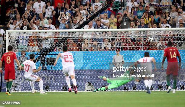 Karim Ansarifard of Iran scores past Rui Patricio of Portugal his team's first goal from the peanlty spot during the 2018 FIFA World Cup Russia group...