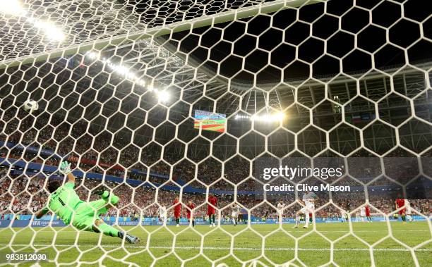 Karim Ansarifard of Iran scores past Rui Patricio of Portugal his team's first goal from the peanlty spot during the 2018 FIFA World Cup Russia group...